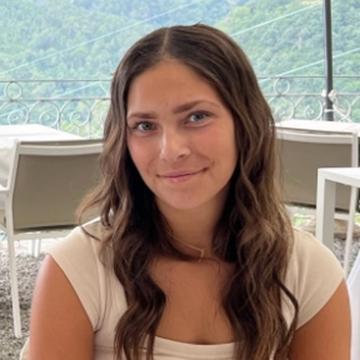Woman smiling in outdoor dining venue
