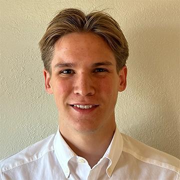 Man in white shirt smiling