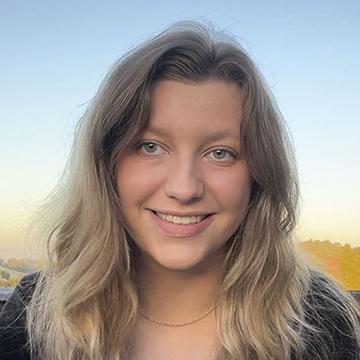 Woman outdoors smiling