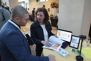 Woman talking about Brand Story Machine at Demo Day 2025 event