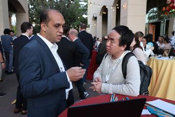 Praneet Jain from Toyful Tabel talking with a man