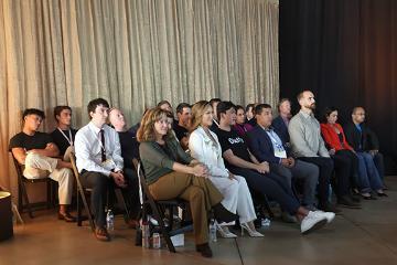 All of the demo day presenters sitting together