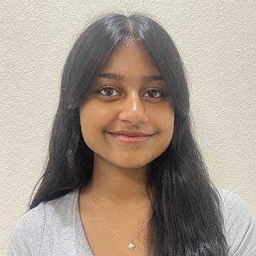 Woman in gray shirt smiling