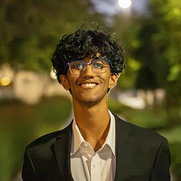 Young man smiling wearing suit jacket