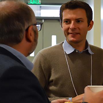 Two people talking at WCWIF 2017 event.
