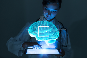 Picture of a woman looking at a holographic image of a brain