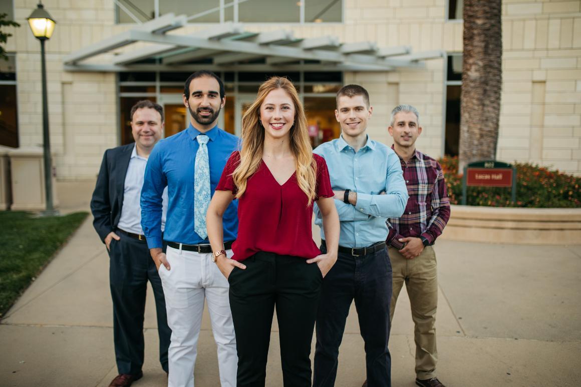 Online MBA - Students standing in front of Lucas Hall Santa Clara University