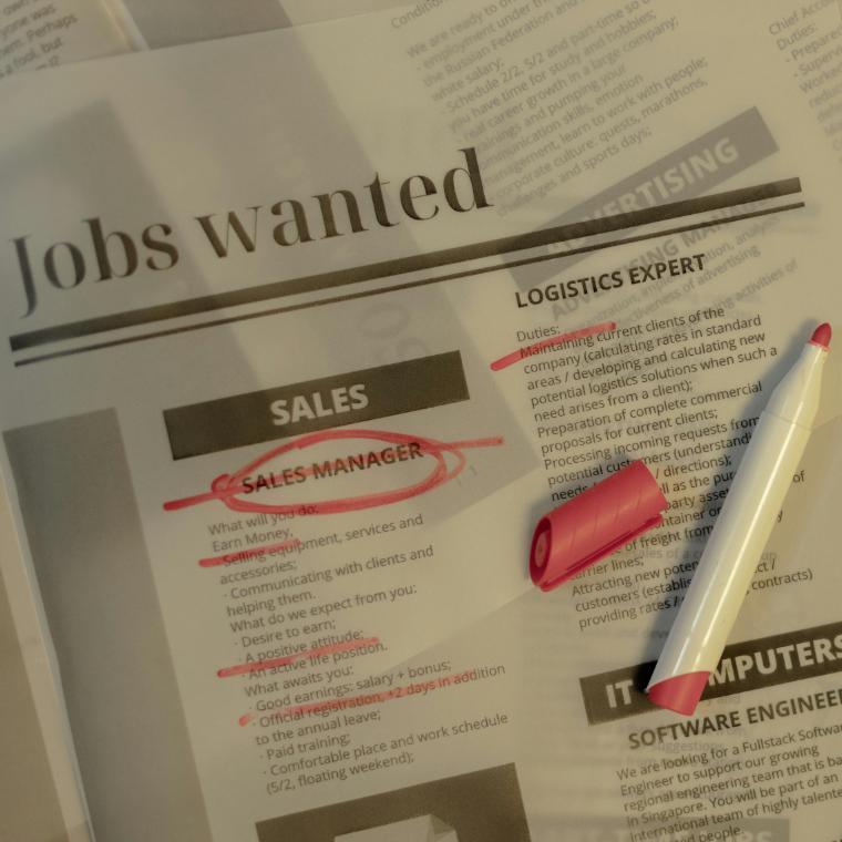 Job opening marked in newspaper 