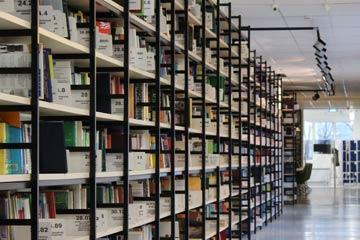 Bookshelves filled with books in a library.