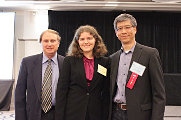 Three people wearing name tags and ribbons pose for a photo at ACTG Scholarships 2015 event. image link to story