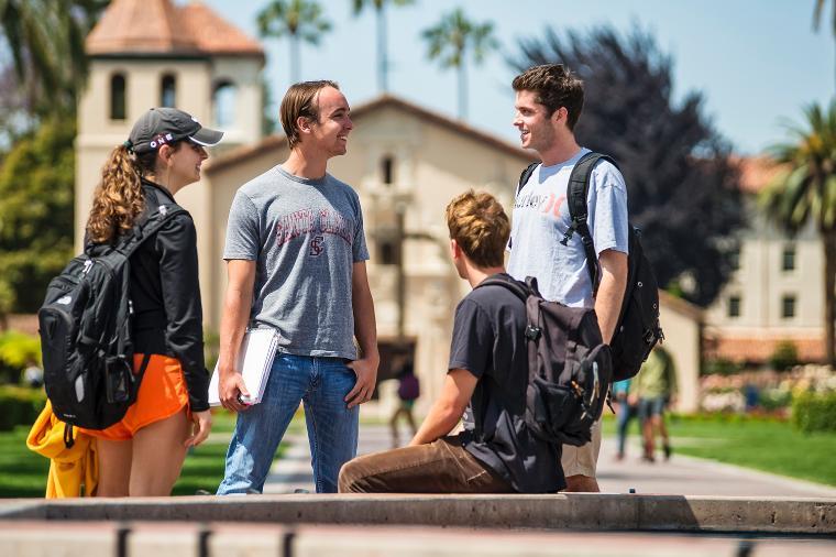 SCU students talking around a campus fountain. - Students Chatting By Fountain Link to file