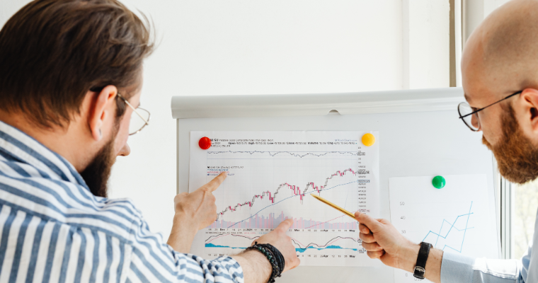 Business professionals analyzing stock performance