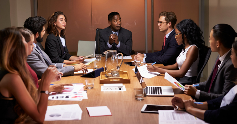 Boardroom of diverse professionals
