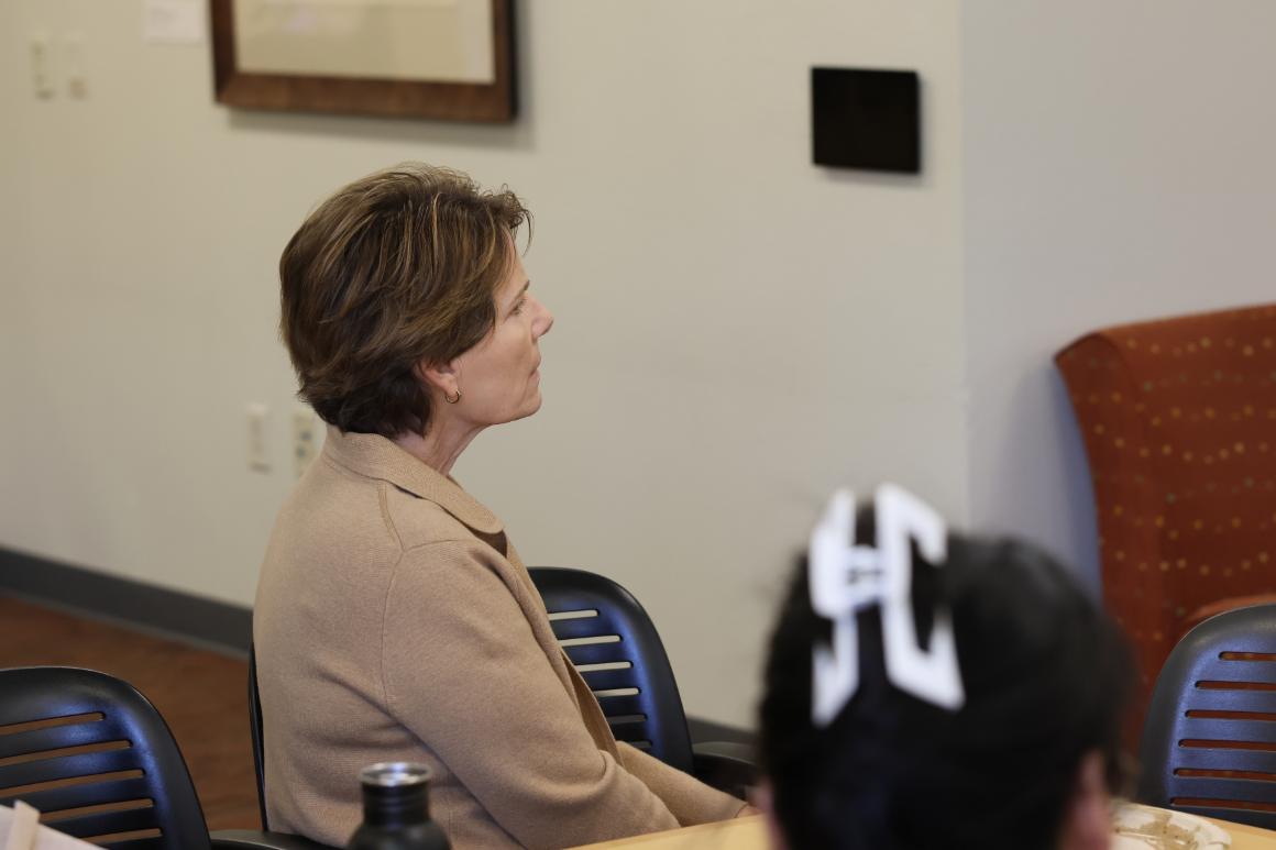 Leavey staff listening attentively to spotlight presentation featuring student athletes and AD Heather Owens