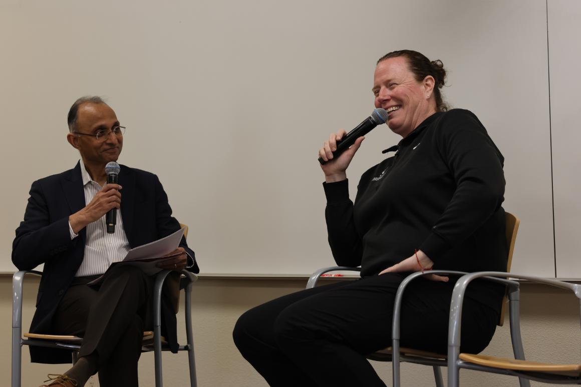 Interim Dean Agrawal and AD Heather Owen laughing in conversation