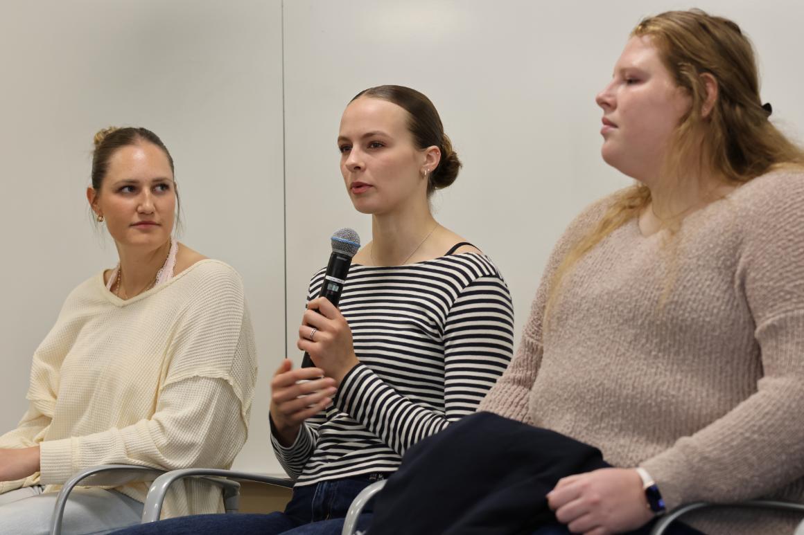 Leavey undergraduate basketball athlete answering question on panel