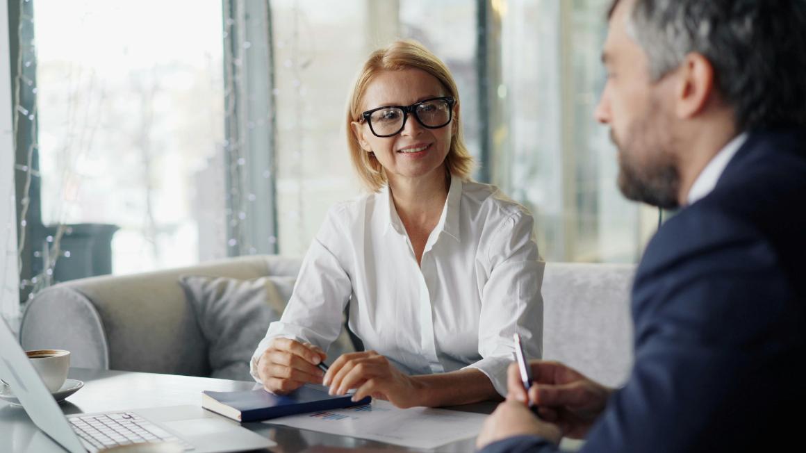 Business professional woman in a client discussion