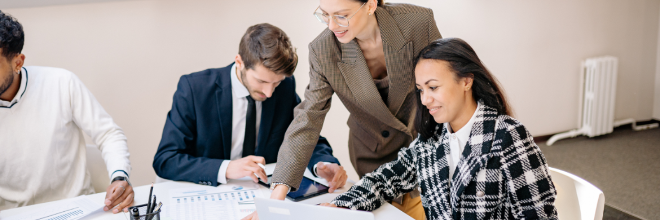 Finance professionals discussing charts