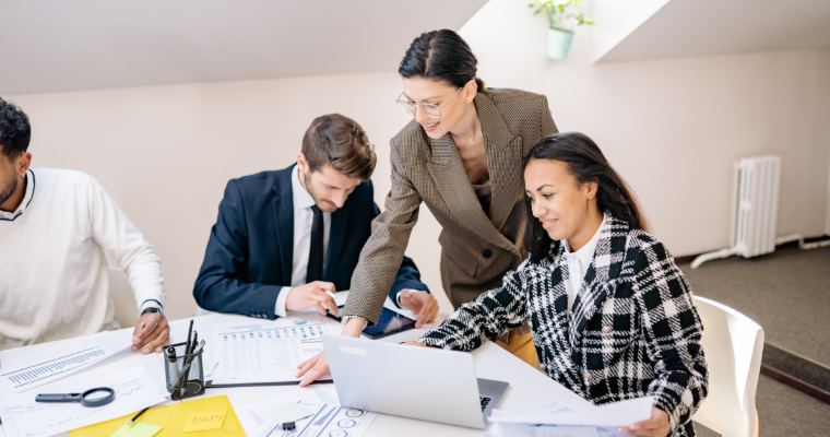 Finance professionals discussing charts