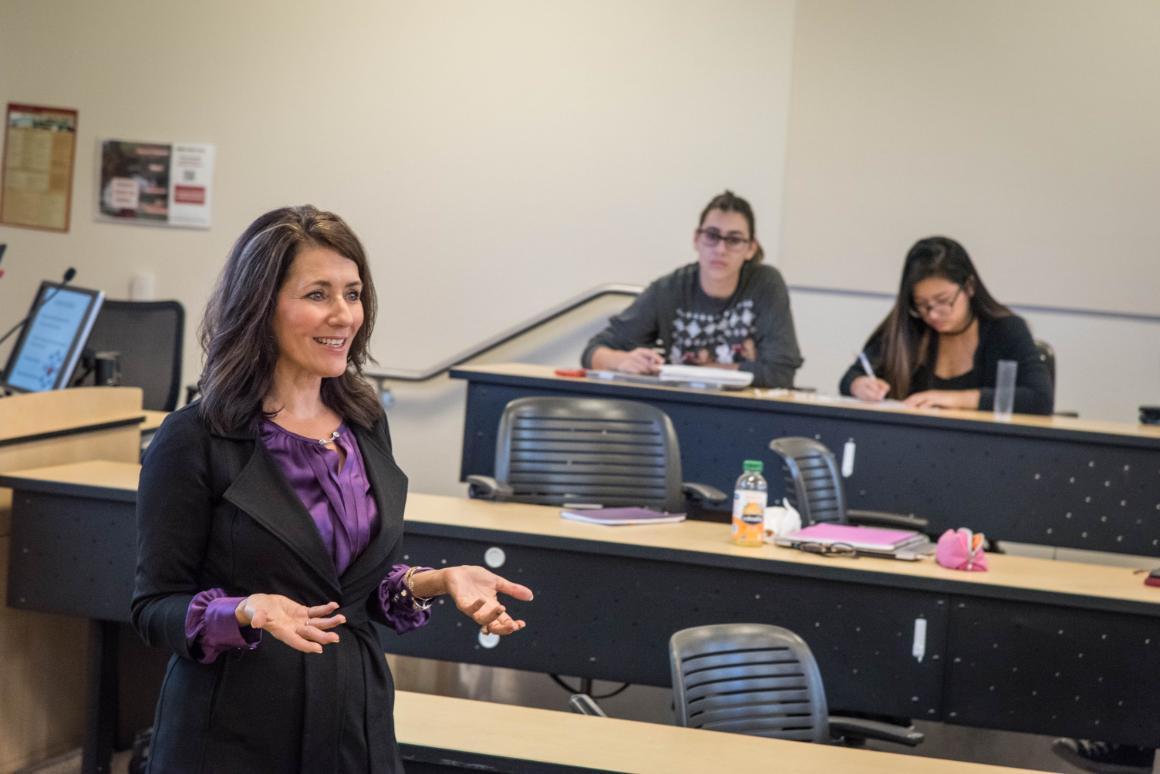 Faculty teaching a classroom of engaged students