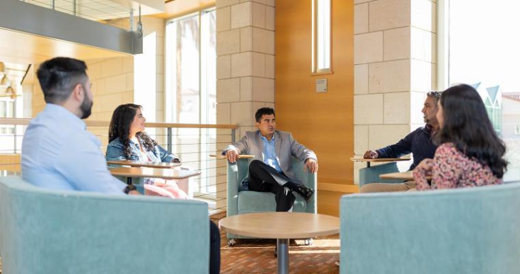 A diverse group of Leavey students networking with each other and faculty