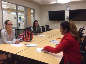 students talking to recruiter