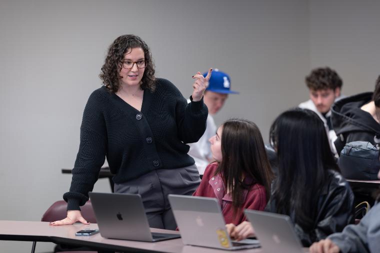Leavey Professor Esther Sackett interacting with students during class