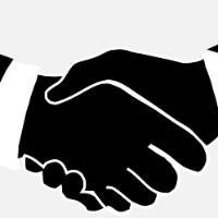 Two black silhouettes shaking hands, signifying agreement or greeting.