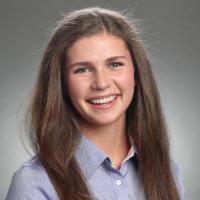 A woman smiling in a professional headshot.