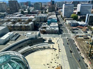 Aerial view of downtown San Jose with various buildings and streets.