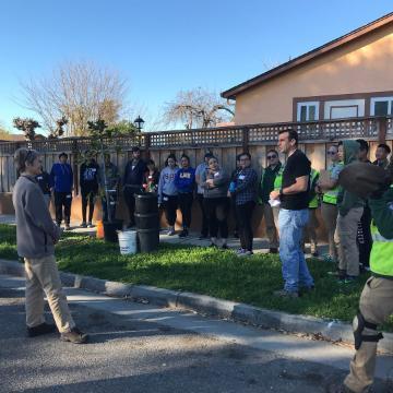 A group of people preparing for a neighborhood clean-up event.