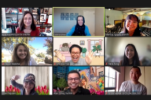 A virtual meeting with nine smiling participants in separate video frames.