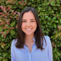 A person with greenery in the background, titled 'Greta Kate Larson'.