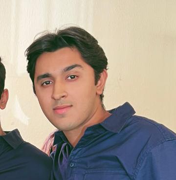 A person wearing a blue shirt.