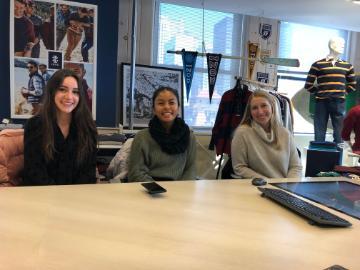 Alt text: RMI students sitting at a table at PVH in 2019.