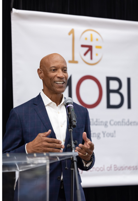 Photo of Dean Grier Speaking at MOBI 10th Anniversary