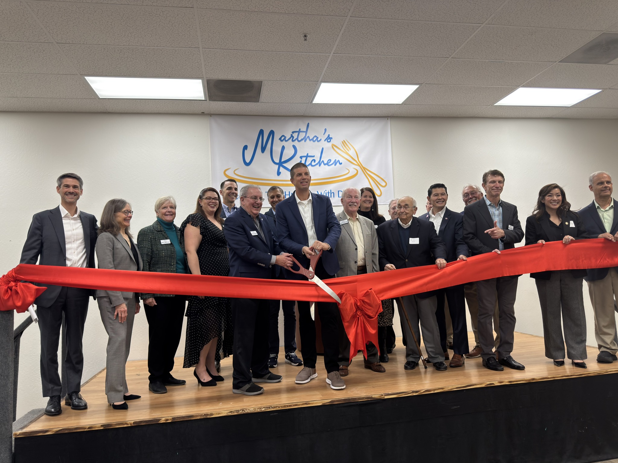 Ribbon Cutting at the Grand Opening of Martha's Kitchen Food Hub  - Photo source Martha's Kitchen Facebook page. image link to story