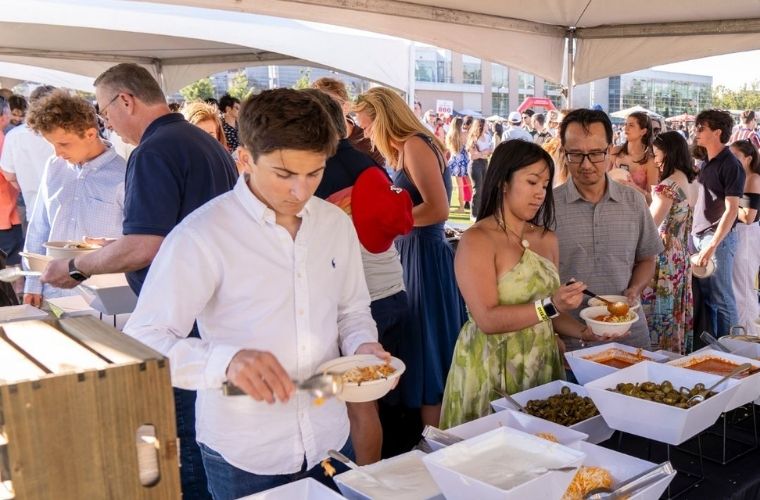 New Grad serving himself food 