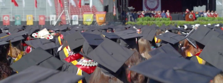 Graduates looking at the stage
