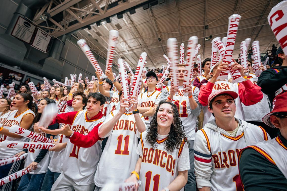 A large group of students cheer on SCU basketball