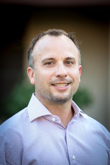 A headshot of John Torrey