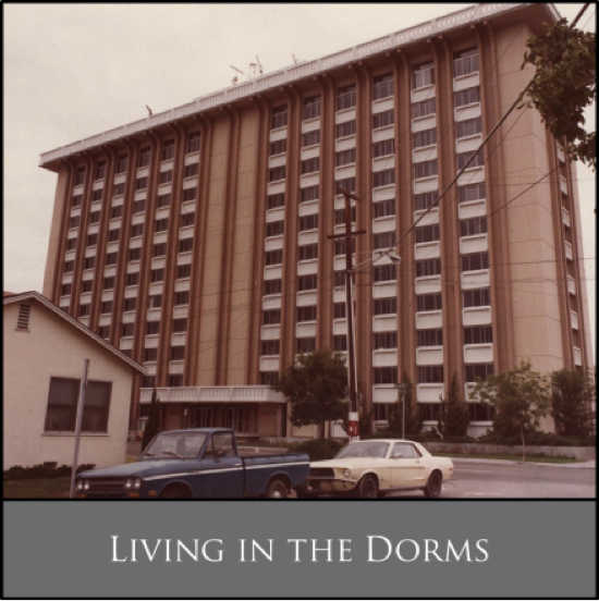 An old dormitory building with parked cars in front. Text reads, 