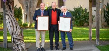 2019 Alumni Award winners flanking University President Fr. Michael Engh, S.J.