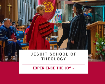 Graduate shaking University President Sullivan's hand.