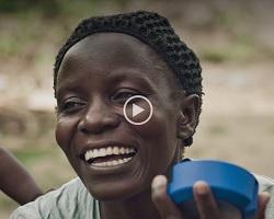 Close up of a woman smiling.