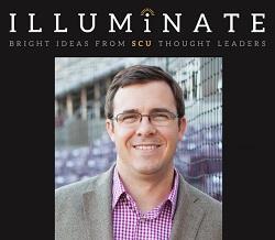 Head shot of man in beige sport coat.