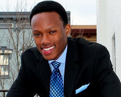 Headshot of a man in a suit.