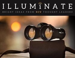 Binoculars sitting on top of a book.