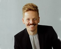 Young man in a black blazer