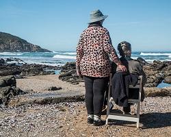 Two women looking out at the ocean.